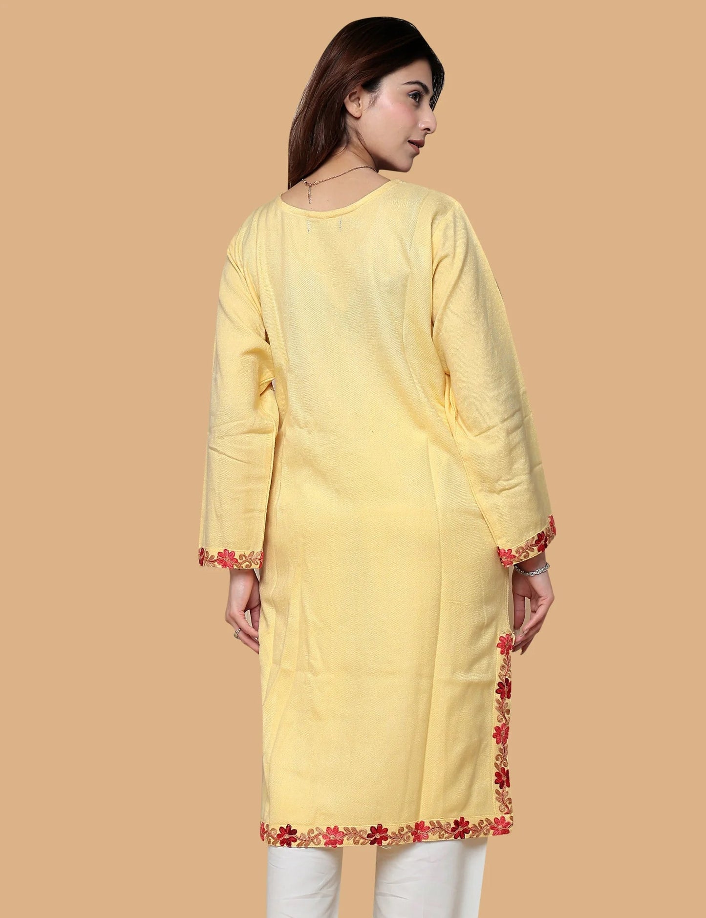 Woman wearing yellow Kashmiri phiran