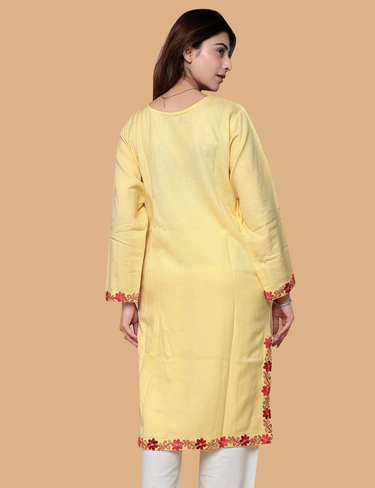 Woman wearing yellow Kashmiri phiran