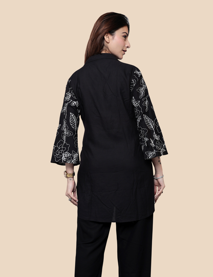 Woman wearing black embroidered short kurti