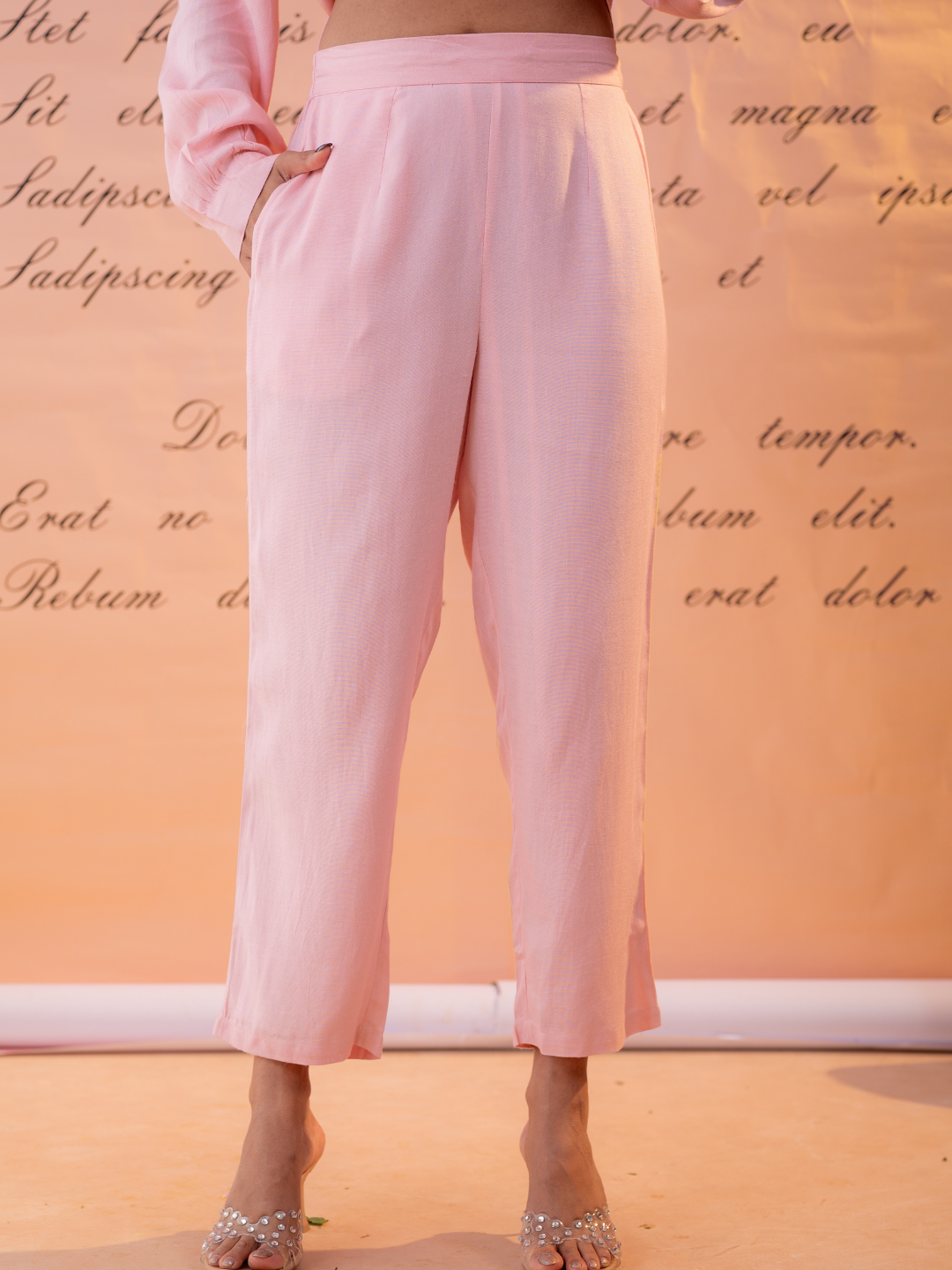 Woman wearing light pink linen hand embroidered co-ord set