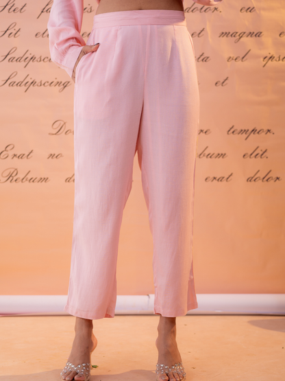 Woman wearing light pink linen hand embroidered co-ord set