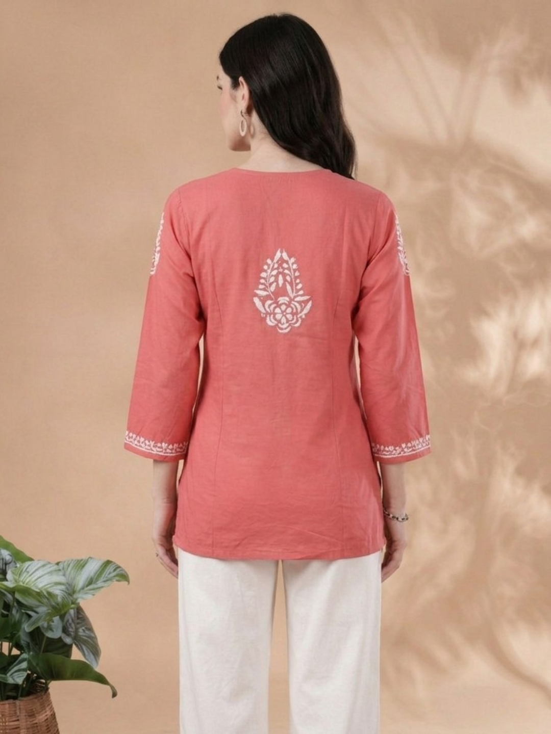 Woman wearing peach rayon Lakhnavi embroidered kurti